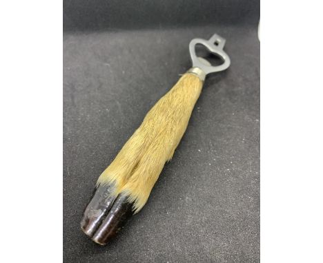 A VINTAGE DEER FOOT BOTTLE OPENER 