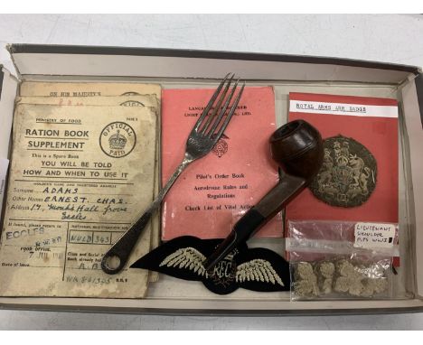 A COLLECTION OF WWI/WWII ITEMS TO INCLUDE UNIFORM BADGES, RATION BOOKS, NAAFI FORK AND A PIPE 