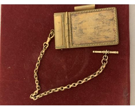A VINTAGE BRASS NOTEPAD AND CHAIN 