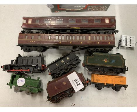A COLLECTION OF HORNBY ENGINE, CARRIAGES AND SEVERAL TRUCKS 