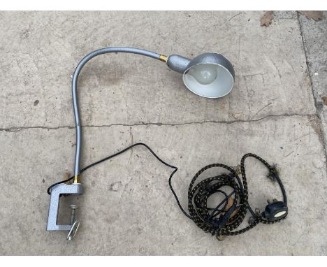 A VINTAGE TABLE MOUNTED LAMP 