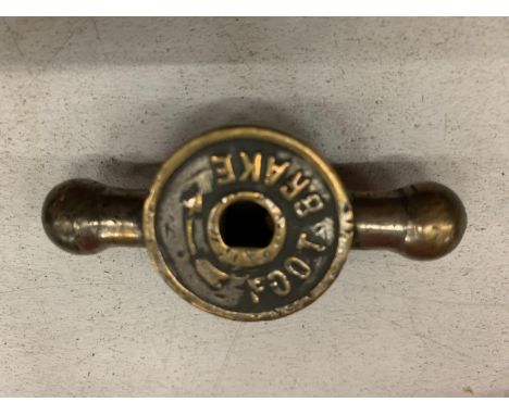 A BRASS FOOT BRAKE KNOB FROM A VINTAGE VEHICLE 