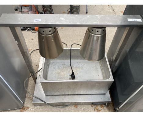 A SILVER BAIN MARIE AND A CATTERING HEAT LAMP 