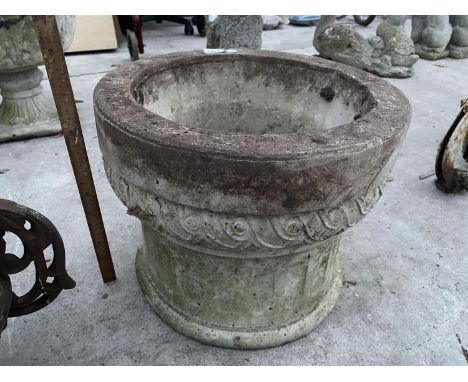 A CONCRETE GARDEN PLANTER 
