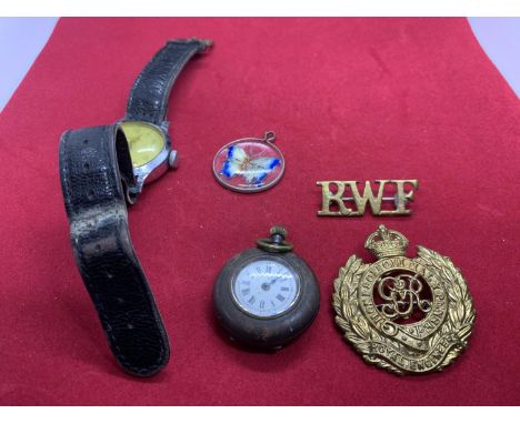 FIVE ITEMS TO INCLUDE A VINTAGE WATCH, A ROYAL ENGINEERS BADGE, AN RWF BADGE, POCKET WATCH AND BUTTERFLY PENDANT 