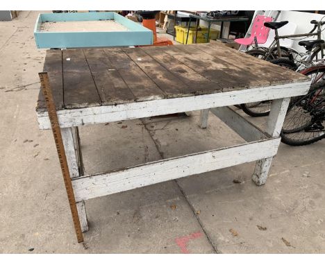 A LARGE VINTAGE WOODEN TABLE 