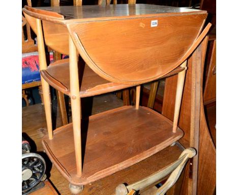 AN ERCOL BLONDE ELM OVAL TOPPED DROP LEAF THREE TIER TEA TROLLEY, approximate size width 73cm x depth 94cm x height 75cm (sd,