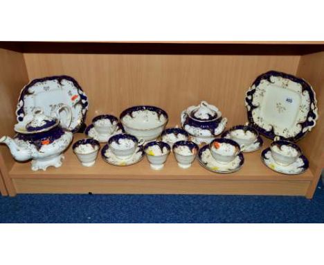 VICTORIAN TEAWARES, cream with blue and gilt border, teapot (af), covered sugar (hairline to lid), teacups/saucers etc