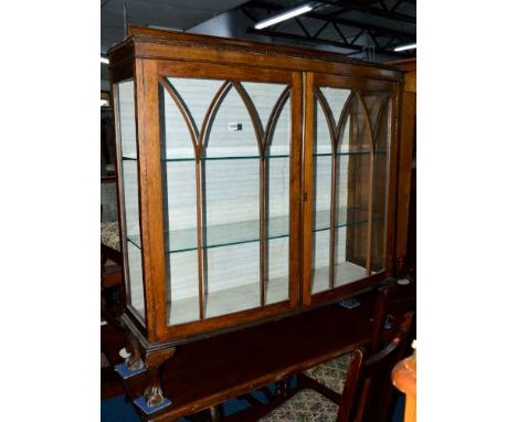 A 20TH CENTURY OAK ASTRAGAL GLAZED TWO DOOR CHINA CABINET, on ball and claw feet, approximate size width 120cm x height 127cm