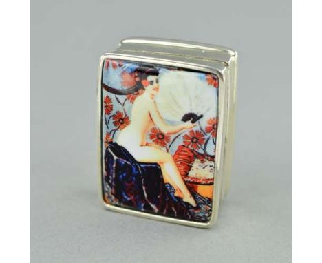 A SMALL ENAMEL PILL BOX, depicting a scantilly clad woman, stamped 'STERLING', approximate length 27mm