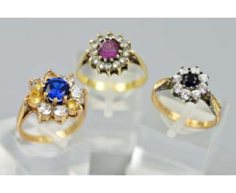 THREE CLUSTER RINGS, most are set with pastes, one hallmarked Birmingham 1973, the other two stamped '9ct & sil', ring sizes 