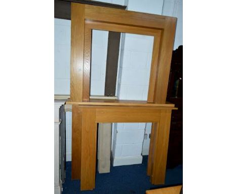 A LIGHT OAK FIRESURROUND, approximate width 119cm, together with two similar fire surrounds (3)