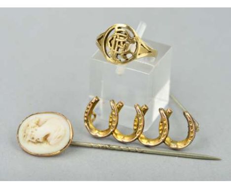 THREE ITEMS OF JEWELLERY, to include a late 19th Century 9ct cameo stickpin, an early 20th Century gold horse shoe brooch, ap