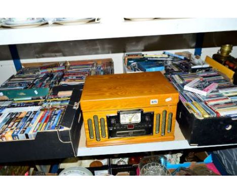 A CROSLEY RECORD AND CD PLAYER MODEL NUMBER 1189986, together with five boxes of CD's and DVD's