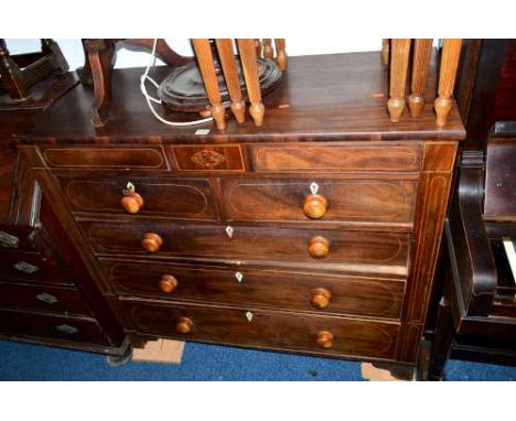 A GEORGIAN MAHOGANY AND SATINWOOD INLAID CHEST, of two short and three long drawers below, two secret drawers with ivory escu