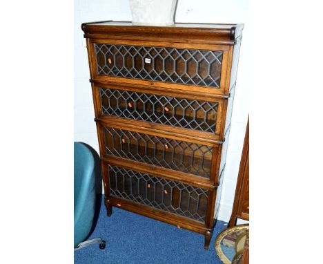 A GLOBE WERNICKE OAK LEAD GLAZED FOUR SECTION SECTIONAL BOOKCASE, approximate size width 87cm x depth 29cm x height 146cm (sd