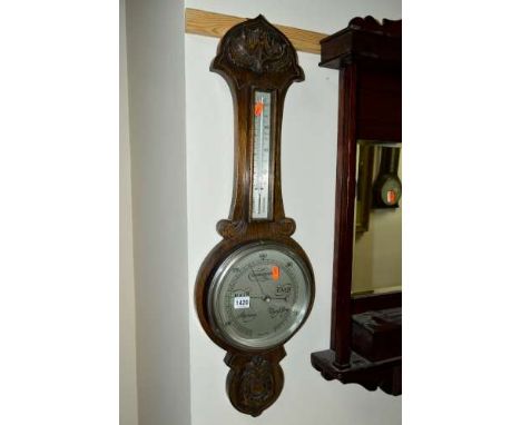 A 20TH CENTURY OAK CASED BAROMETER