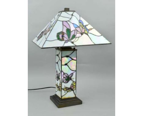 A TIFFANY STYLE TABLE LAMP, square canopy shade with square shaped illuminated column, decorated with butterflies, on a stepp