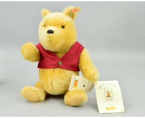 A BOXED LIMITED EDITION STEIFF 'WINNIE THE POOH 27 BEAR', No 05609/10000, No 651489, honey yellow mohair wearing red waistcoa