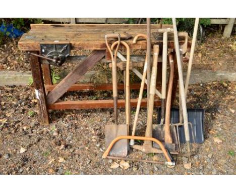 A VINTAGE 4FT 10' WOODEN WORKBENCH, fitted with a Record No 52 1/2 vice, together with various garden tools and walking stick