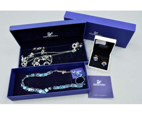 SIX ITEMS OF SWAROVSKI JEWELLERY, to include two pairs of drop earrings, a pair of circular cufflinks, a V-shaped necklace se