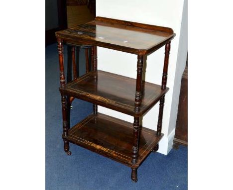 A VICTORIAN ROSEWOOD AND INLAID THREE TIER WHAT NOT, with turned uprights, on ceramic casters, approximate size width 58cm x 