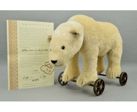 A BOXED LIMITED EDITION STEIFF 'POLAR BEAR ON WHEELS 1910', No 00800/1000, No 400544, mounted on six spoke wheels, when his h