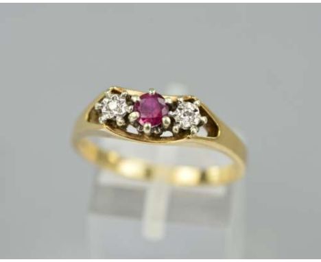 A 9CT GOLD RUBY AND DIAMOND RING, designed as a central circular cut ruby flanked by modern round brilliant cut diamonds, hal