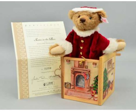 A BOXED LIMITED EDITION STEIFF 'SANTA IN THE BOX' No 1058/1500, No 038419, made of alpaca and wearing bobble hat and coat, in