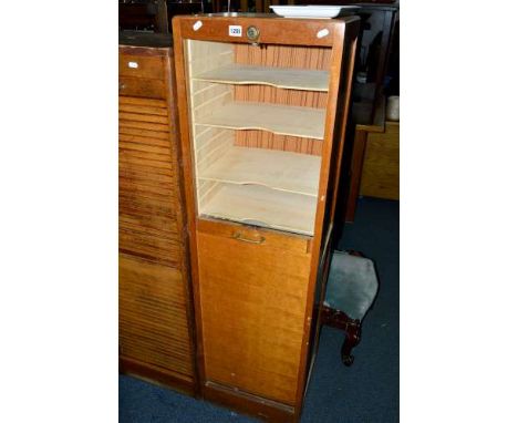 AN OAK FRAMED ROLL FRONT CABINET, approximate size width 43cm x depth 38cm x height 150cm