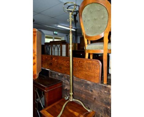AN ARTS & CRAFTS BRASS TELESCOPIC STANDARD LAMP, and a brass fender (2)