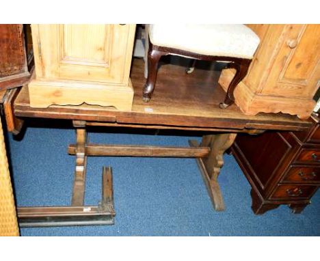 A 20TH CENTURY OAK DRAW LEAF TABLE, on a stretchered base, approximate size width 137cm x depth 81cm x height 76cm, together 