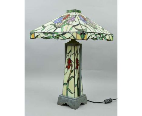 A LARGE TIFFANY STYLE TABLE LAMP, having square canopy shaped shade, central illuminated column, with metal supports and base