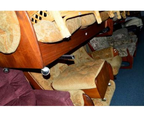 A G-PLAN TEAK FOUR PIECE SADDLE LOUNGE SUITE, with gold upholstery, Pirelli padding on orbit castors, comprising of a three s