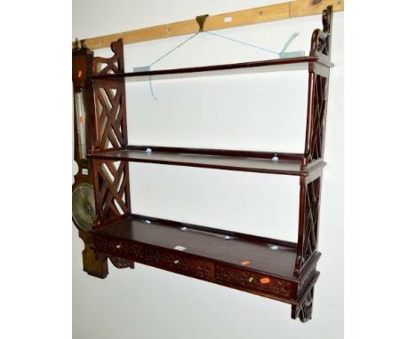 A REPRODUCTION MAHOGANY THREE TIER HANGING WALL SHELF, with three drawers