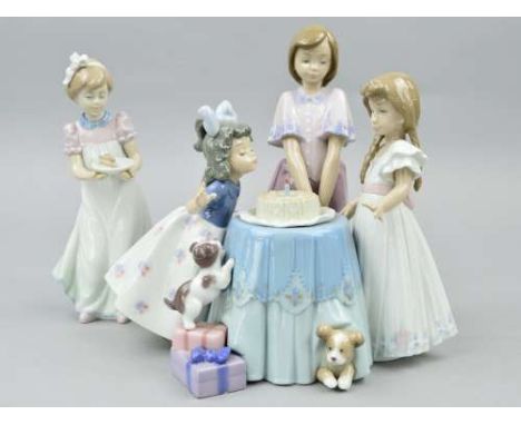 A LLADRO FIGURE GROUP 'Making a Wish' No 5910 depicting a young girl blowing out a candle on her birthday cake with two sibli