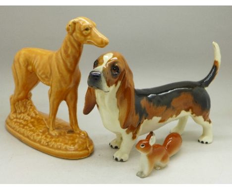 A Beswick model of a Basset hound, a model of a greyhound and a squirrel