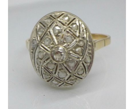 A yellow and white metal set Art Deco ring, set with old cut diamonds, 4.7g, W
