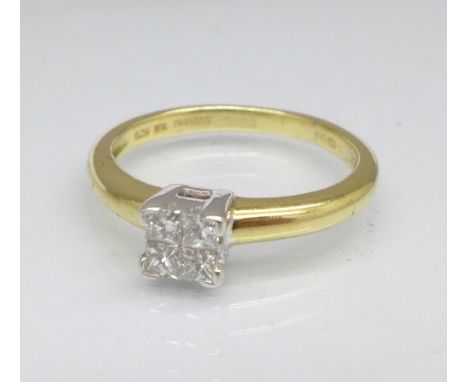 An 18ct gold ring set with four princess cut diamonds, 3.3g, K