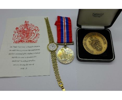 A lady's gold plated Rotary wristwatch, a WWII medal and a medallion