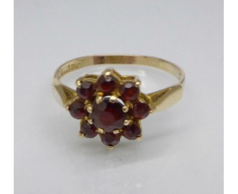 A 9ct gold and garnet cluster ring, 1.8g, N