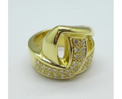 An 18ct gold ring marked 750, 0.5 carat diamond weight, 12.1g, N