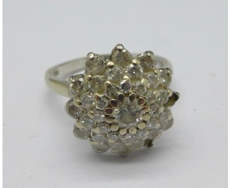 An 18ct white gold and diamond cluster ring, two stones missing, 5.6g, N