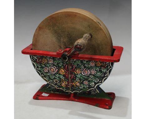 A bargeware manual sandstone knife shapener, painted base, 31cm wide, 31cm high 