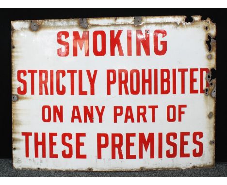 A large rectangular enamel sign, 'Smoking Strictly Prohibited On Any Part Of These Premises', 91cm x 122cm, c.1940-1950 