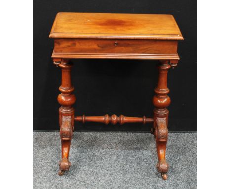 A Victorian mahogany work/sewing table, rectangular hinged top opens to reveal an arrangement of sewing compartments, turned 