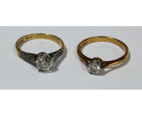 An 18ct gold diamond solitaire ring, the shoulders accented with diamond chips, 2.1g; an 18ct gold diamond solitaire ring, 2.