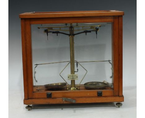 A set of scientific laboratory balance scales, by Phillip Harris Ltd, Birmingham, glazed cabinet, 39cm high 