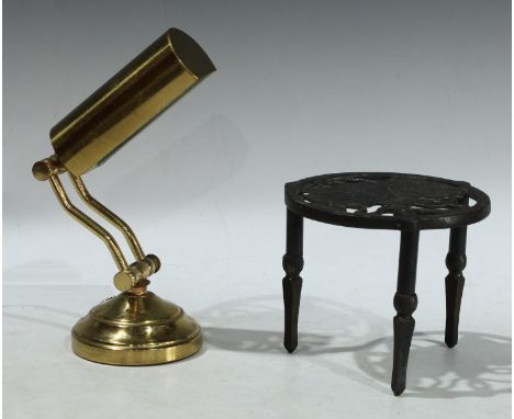 A brass desk lamp; a Bonzo the dog cast iron trivet 
