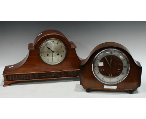 A flame mahogany mantel clock, arched case, silvered dial, Arabic numerals, twin winding holes, bracket feet, 55cm; a walnut 